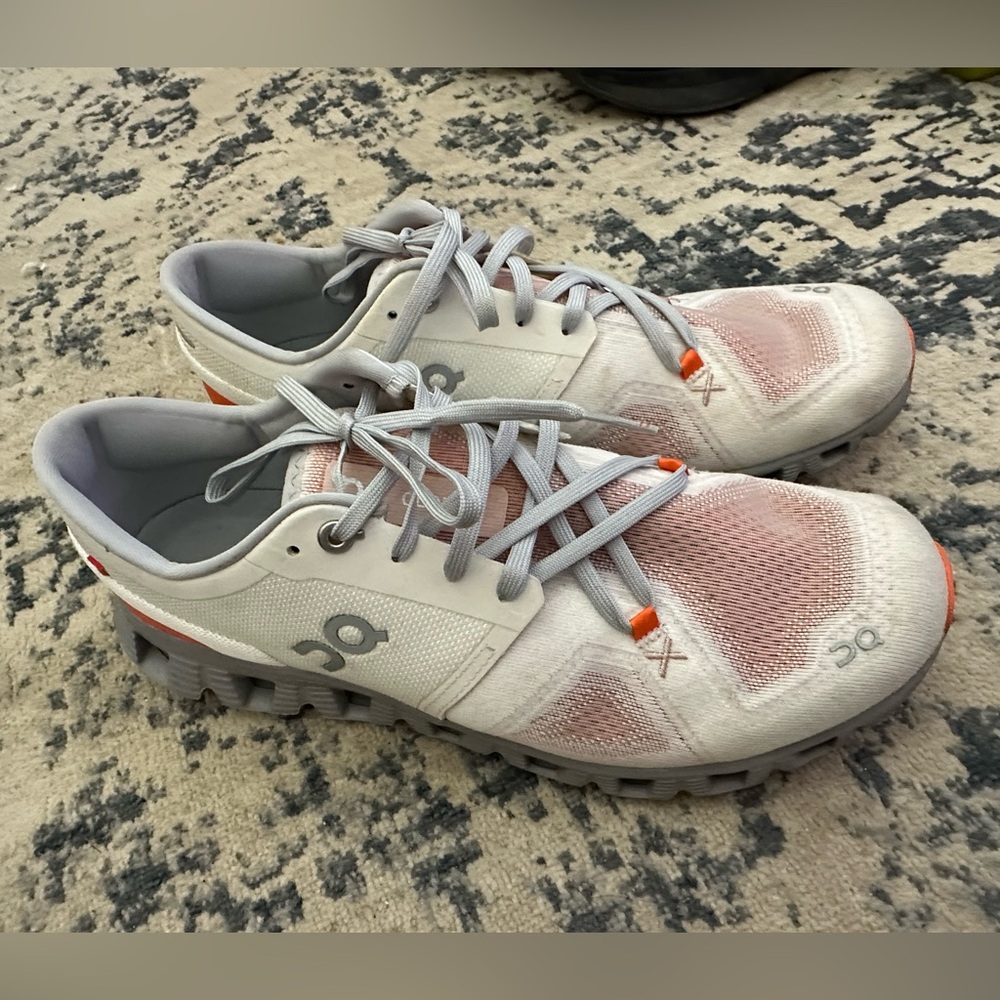 On Running White and Orange Sneakers